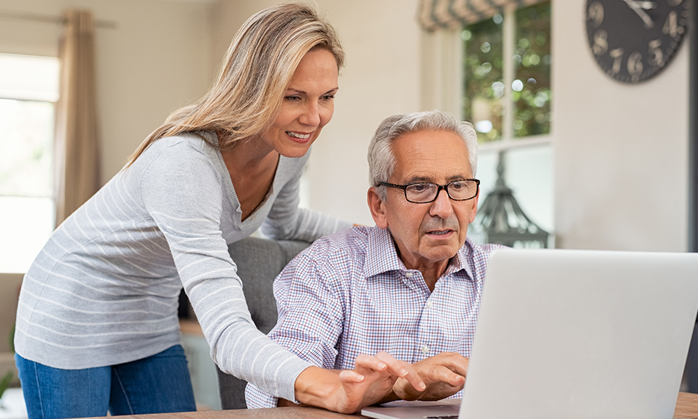 Senior man focusing on his tablet
